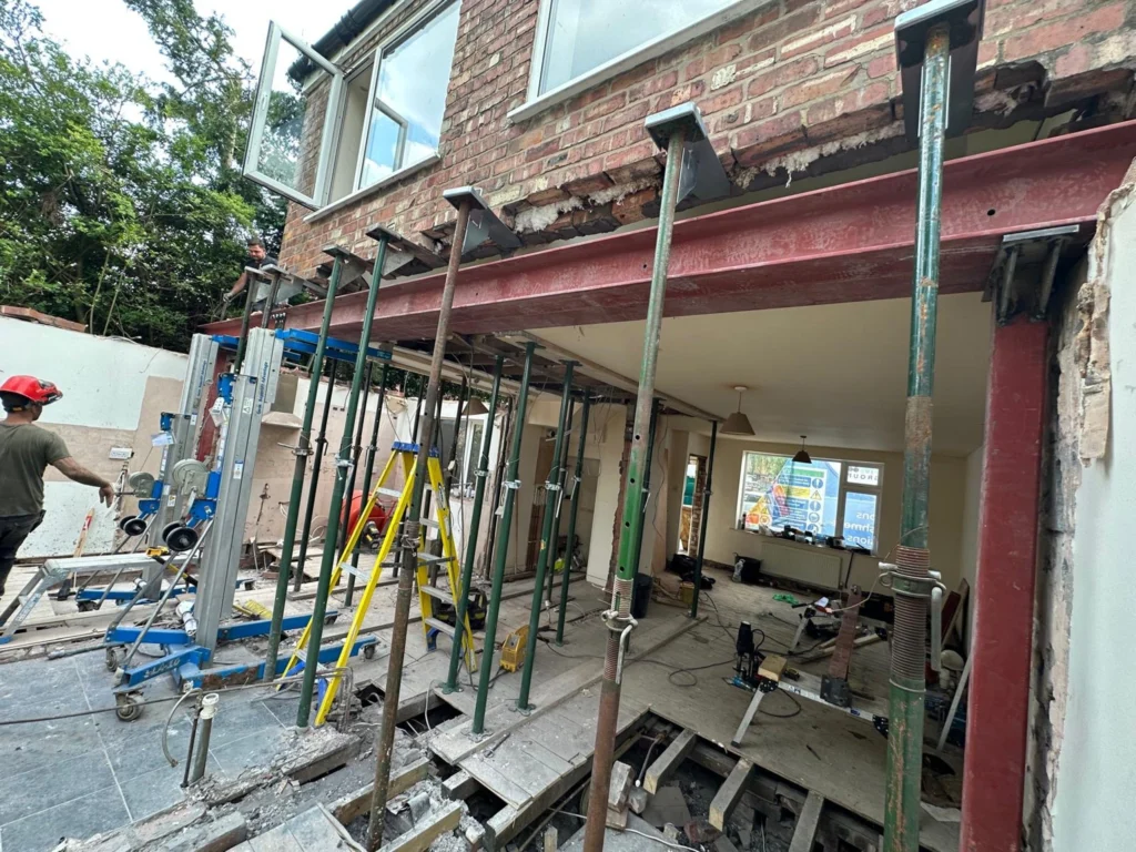 Temporary supports and a steel beam during building work