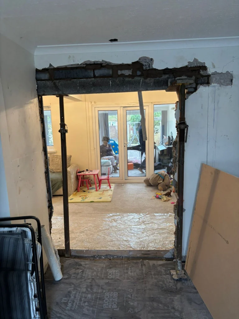 Temporary supports around a load-bearing wall opening