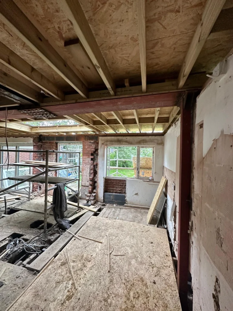 Exposed steel beams and timber joists during structural work